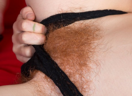 Skinny redhead Roxy shows her hairy pits and fiery crotch - 9 of 16