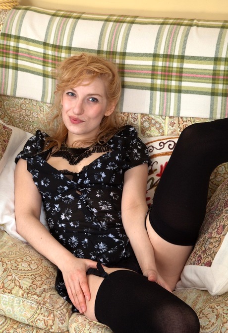 Horny blonde tease Alice spreads her fluffy muff wide open