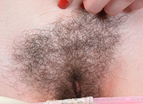 Gorgeous Emma strips down and opens up her unshaved honeypot