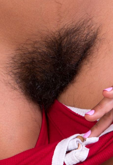 Petite tan babe Vivi Marie reveals her thick furry crotch