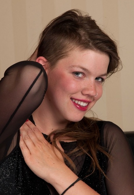 Hairy amateur Adrienne Bijoux teasing in fishnet bodysuit - 4 of 16