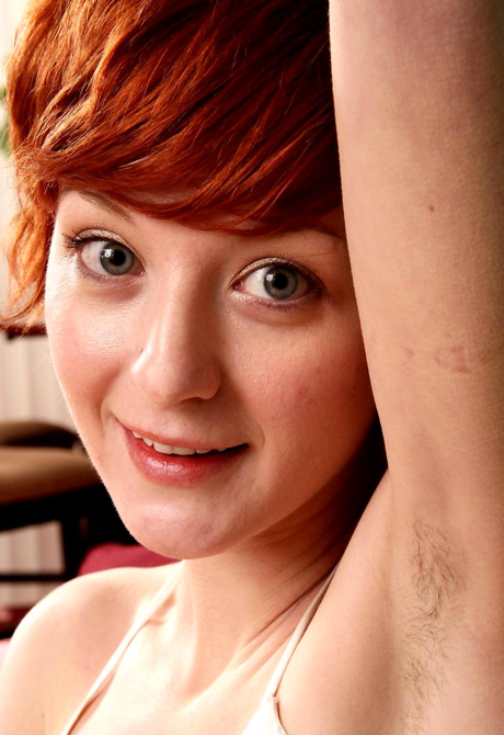 Flirty redhead Agnes shows her furry pits and fuzzy snatch