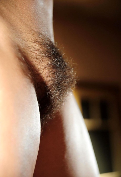 Exotic Andrea lifts her skirt to tease her beautiful bush - 9 of 15