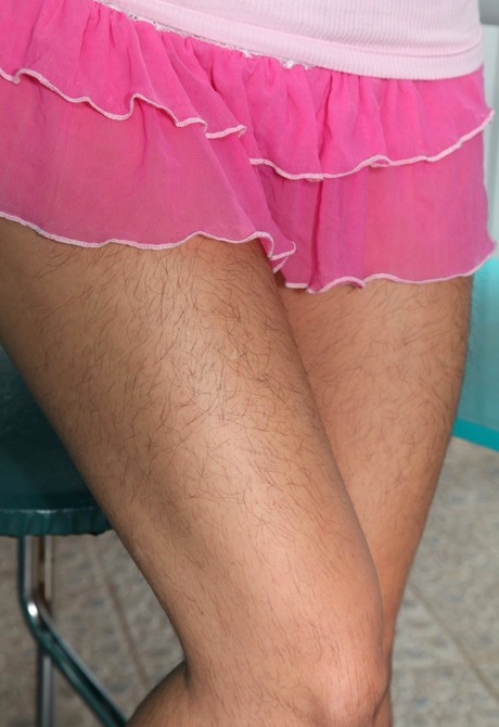 Petite hairy babe Angie showing her furry legs and snatch - 2 of 16