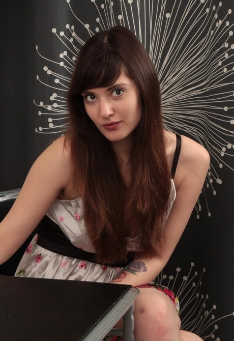 Provocative Anni caresses her naturally thick bushy coochie