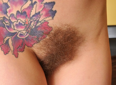 Pierced and tattooed amateur showing her hairy pussy - 16 of 16