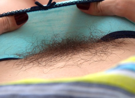 Naughty Bella pulls down her panties to reveal her hot bush