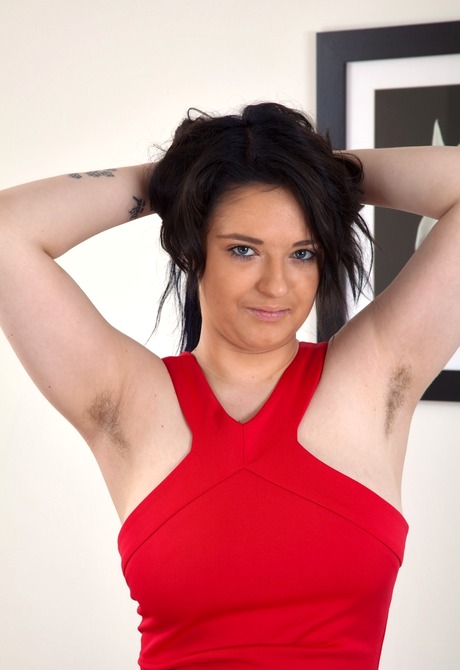 Flirty Billie lifts her dress to share her unshaved snatch