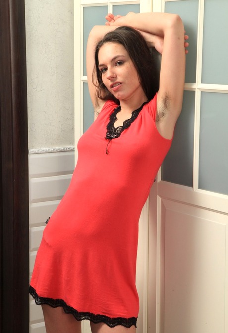 Captivating Cannela strips down to show her big hairy bush - 2 of 16