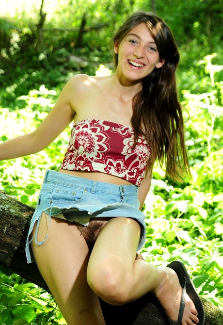 Playful beauty Carmela teases with her fluffy muff outdoors - 3 of 15