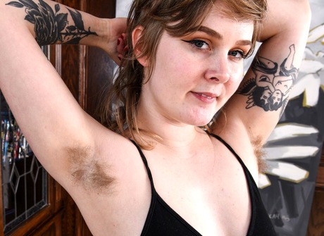 Tattooed young Claire shares her hairy pits and untamed bush - 3 of 16