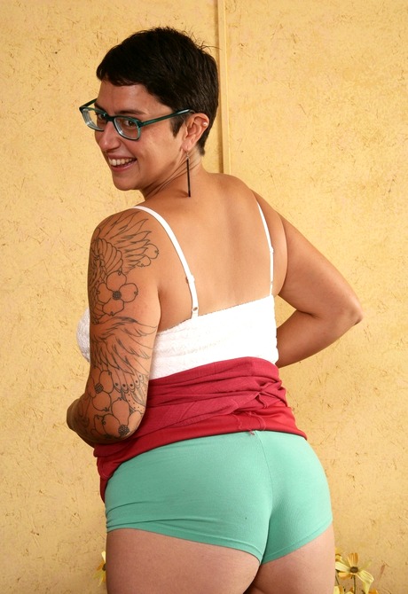 Curvy Cora teases with her furry pits and big full bush