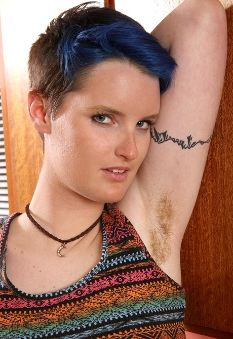 Edgy Cyan shows her hairy legs pits and bush in the kitchen - 3 of 16