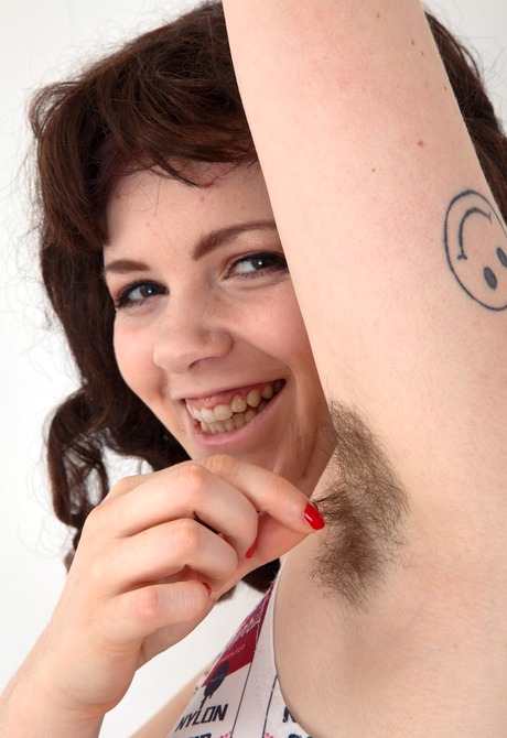 Tattooed brunette Cynthia teases her furry pits and hot bush - 3 of 16