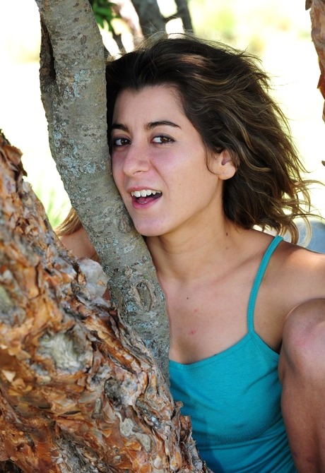 Natural hairy amateur Danielle teasing by tree outdoors
