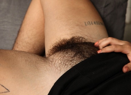 Buxom bombshell Ezra lifts her skirt to show her hairy bush - 13 of 16