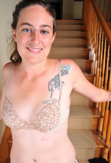 Isis strips and spreads her legs to expose her hairy crotch - 7 of 16