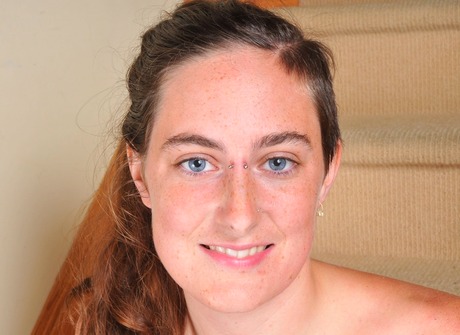 Isis strips and spreads her legs to expose her hairy crotch - 16 of 16