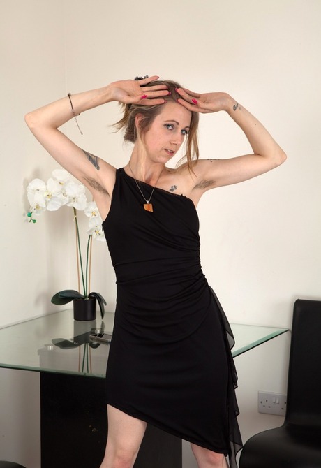 Flirty Izzy exposes her hairy armpits and full shaggy crotch - 2 of 16