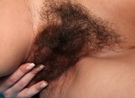 Hot nerdy babe Katalina pets her furry monkey on a table - 11 of 16