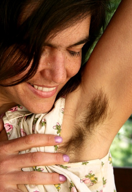 Natural Katie unleashes her huge bushy beaver on the patio - 5 of 16