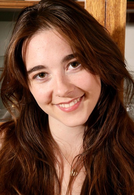 Teen honey Krissy strips to show off her young hairy snatch