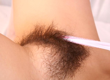 Beautiful Kristina plays with her natural bush in lingerie - 6 of 15