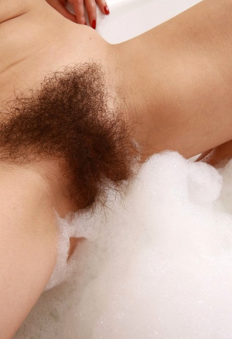 Curvy natural Kristina washing hairy pussy in bathtub - 5 of 16