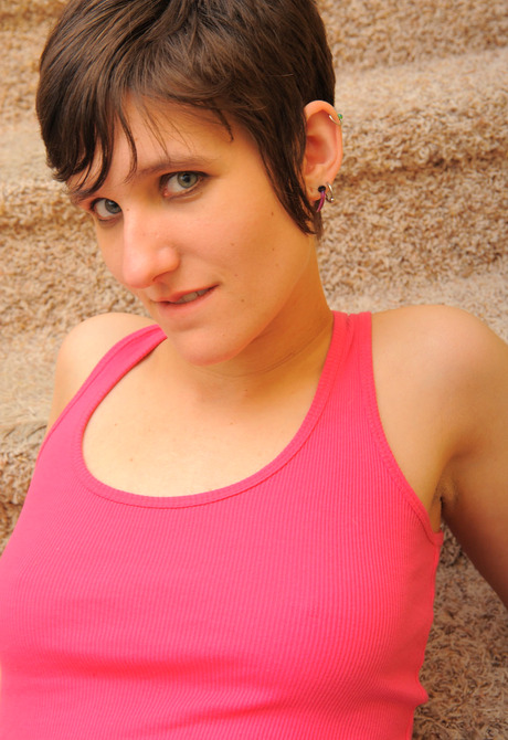 Short haired Laurel pulls down her panties and rides a dildo