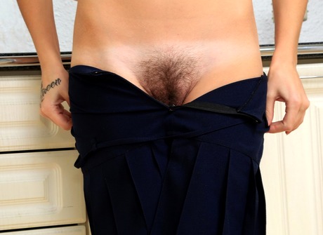 Sensual babe Lou lifts her skirt and pets her furry monkey - 8 of 16