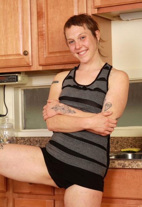 Natural tattooed amateur Mary showing hairy pits and pussy
