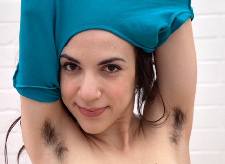 Beautiful Matilda exposes her hairy pits and untamed snatch