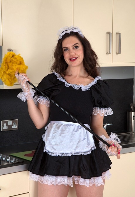 Maid Melissa lifts her dress and teases her woolly snatch - 1 of 16