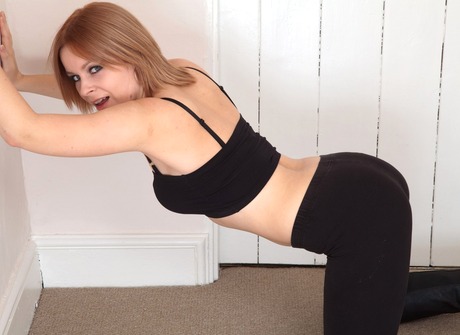 Foxy Minnie teases on her knees and spreads her bush open