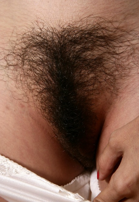 Exotic brunette Mitena lets you see her big furry monkey - 5 of 16