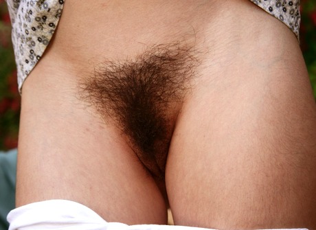Lovely Mitena shows her furry pits and spreads hairy crotch - 8 of 16