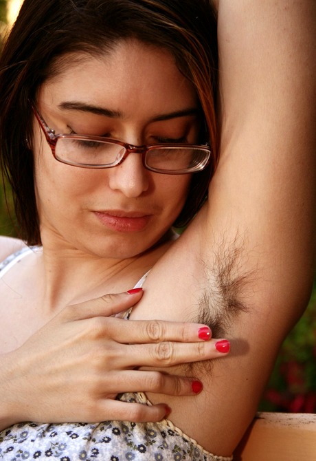 Lovely Mitena shows her furry pits and spreads hairy crotch