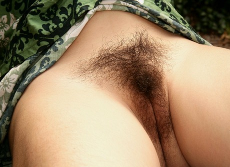 Dark beauty Mitena exposes her fuzzy pits and shaggy crotch - 8 of 16