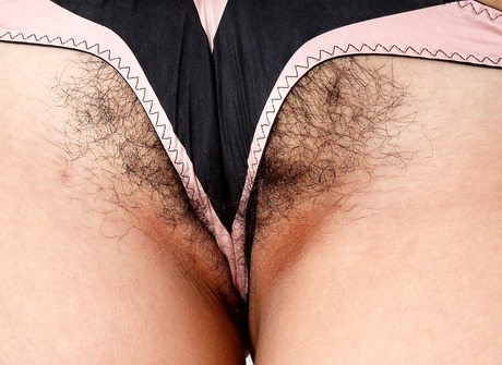 Playful brunette Nanetl lifts her dress to share her snatch - 4 of 16