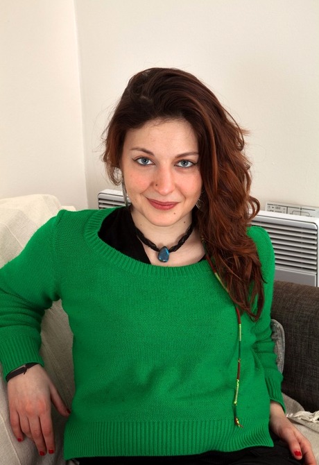 Natural amateur Natalia gets naked and spreads on couch - 2 of 16