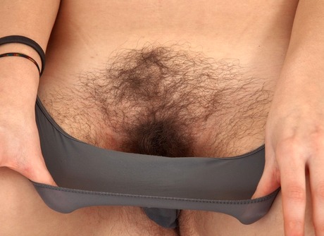 Natural amateur Natalia gets naked and spreads on couch - 7 of 16