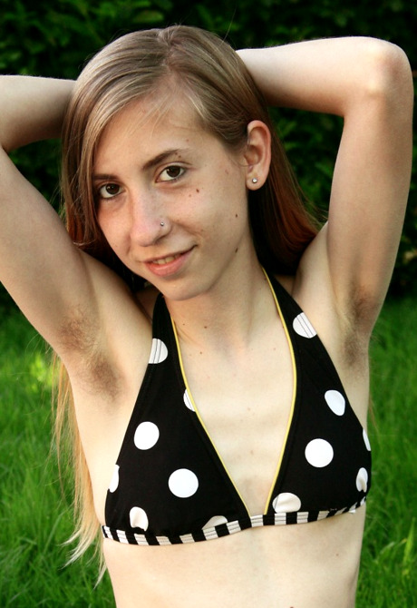 Skinny teen Nessa shares her furry pits and giant snatch