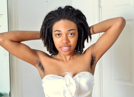 Black beauty Olivia flaunts her furry pits and kinky bush