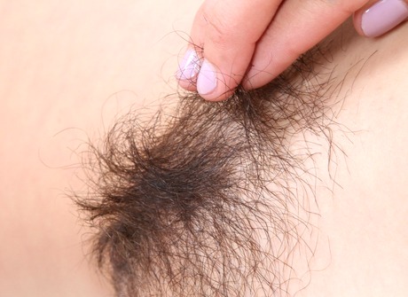 Stunning babe Raven Rockette strips and plays with her muff - 11 of 16