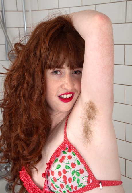 Horny redhead Rosie shows her hairy pits and hot wet beaver - 3 of 16