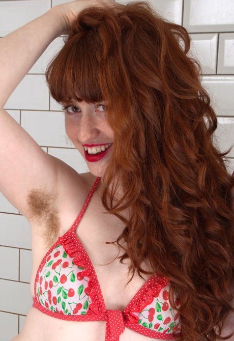 Horny redhead Rosie shows her hairy pits and hot wet beaver