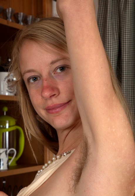 Tall blonde Selena pulls off her panties to show her bush - 8 of 16