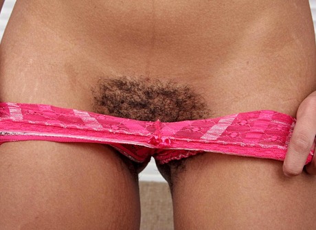 Dark Tess shows off her hot body and fingers her furry twat - 4 of 15