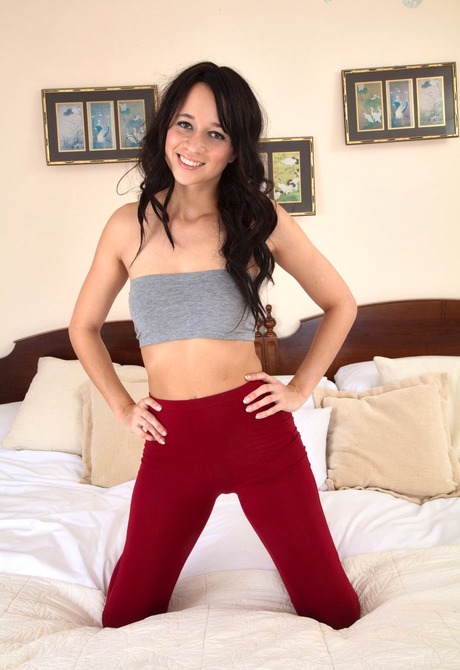 Cute Tracy strips to expose her happy trail and hairy snatch - 2 of 16