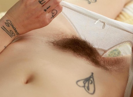 Little tattooed Wynd pleasures her bushy hole with a dildo - 7 of 15